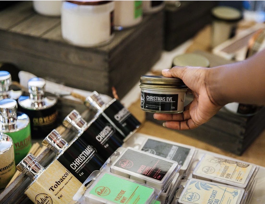 Small business owner showcasing products at an event